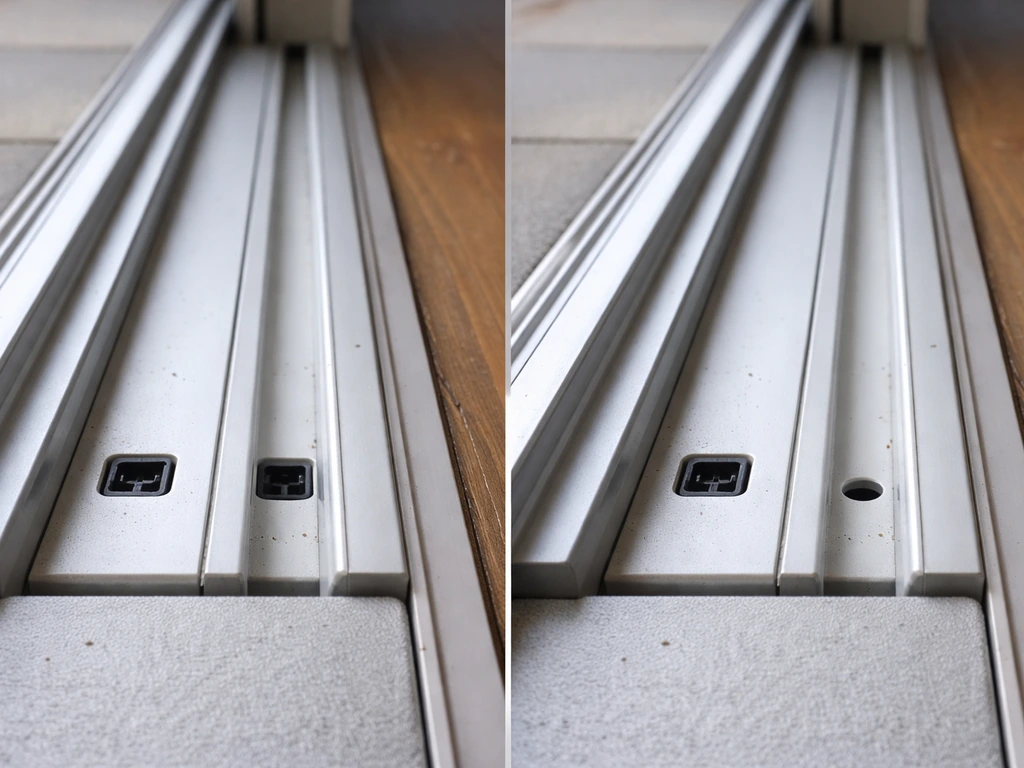 Close-up of a sliding patio door bottom track and sill showing mirrored and one-sided drain holes.
